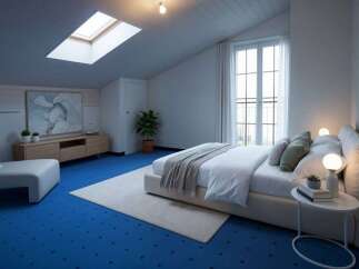 Experience modern comfort in this attic bedroom, featuring a spacious king-sized bed with plush linens and a cozy throw.