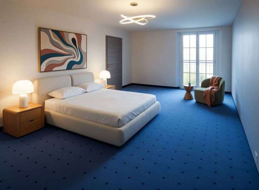 Experience modern comfort in this beautifully appointed bedroom, featuring a plush king-size bed with crisp white linens and two matching nightstands with elegant mushroom-shaped lamps.