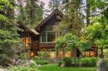 Nestled amidst towering trees, this stunning mountain home offers a serene retreat with its rustic charm and natural beauty.