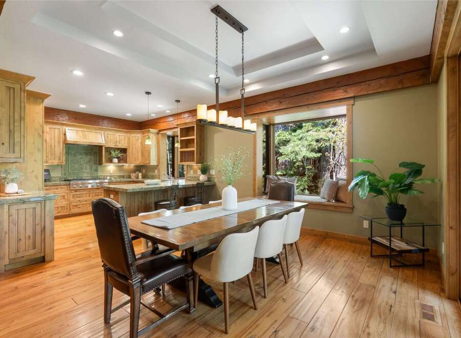 Experience rustic charm and modern convenience in this stunning kitchen and dining area.