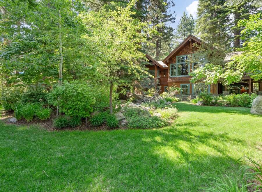 Nestled amidst lush greenery and mature trees, this stunning property offers a serene retreat.