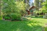 Nestled amidst lush greenery and mature trees, this stunning property offers a serene retreat.