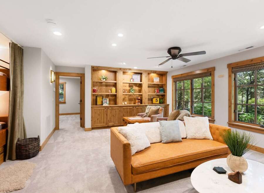 This inviting living space features a cozy bunk bed area, perfect for guests or family.