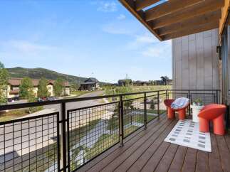 Enjoy breathtaking mountain views from this modern balcony, perfect for relaxing or entertaining.