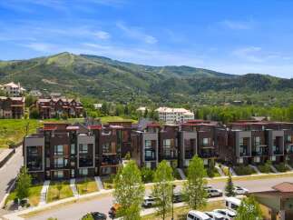 Discover modern luxury living in this stunning townhome development, nestled against a backdrop of majestic mountains.