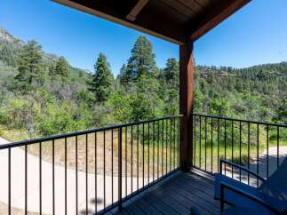 Enjoy breathtaking mountain views from this private balcony, perfect for your morning coffee or evening relaxation.