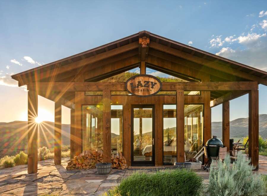 Experience the ultimate mountain retreat in this stunning cabin, featuring expansive glass walls that bring the breathtaking landscape indoors.
