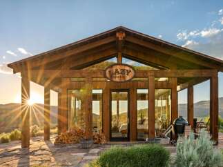 Experience the ultimate mountain retreat in this stunning cabin, featuring expansive glass walls that bring the breathtaking landscape indoors.