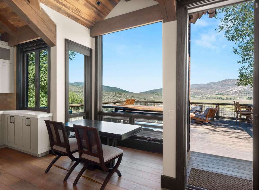 Experience breathtaking mountain views from this stunning home, featuring a spacious deck perfect for outdoor entertaining.