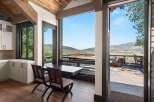 Experience breathtaking mountain views from this stunning home, featuring a spacious deck perfect for outdoor entertaining.