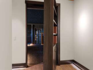 Step into a world of wonder with this unique home featuring a celestial-themed ceiling that mimics a starry night sky.
