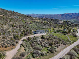 Discover this stunning mountain retreat, perfectly situated on a sprawling hillside with breathtaking panoramic views.
