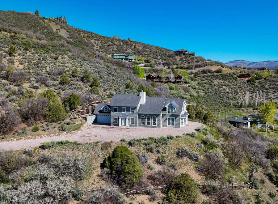 Nestled on a scenic hillside, this stunning property offers breathtaking views and a sense of secluded luxury.