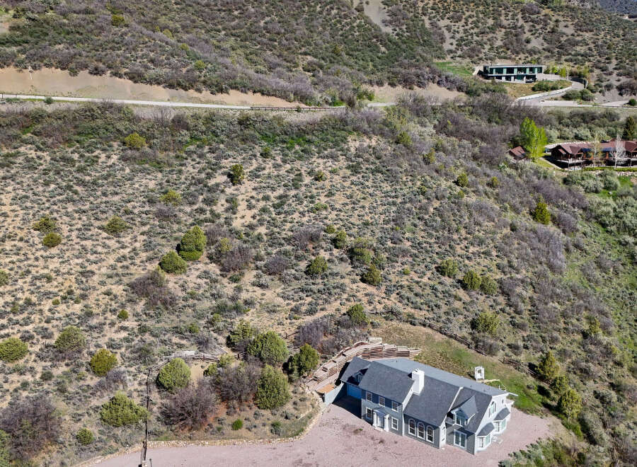 Discover this stunning multi-level home nestled on a sprawling hillside, offering breathtaking panoramic views.
