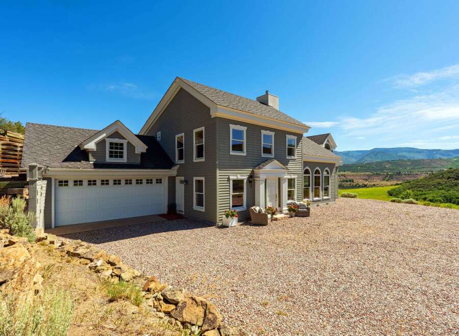 Discover this stunning home nestled in a picturesque landscape, offering breathtaking mountain views.