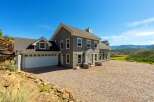 Discover this stunning home nestled in a picturesque landscape, offering breathtaking mountain views.