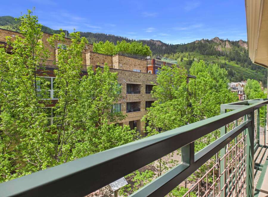 Enjoy breathtaking mountain views from this stunning property, featuring modern architecture and lush greenery.