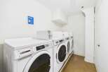 Discover the convenience of this on-site laundry facility, featuring multiple Maytag high-efficiency washers.
