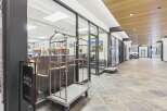 Experience the welcoming ambiance of this property's lobby, featuring a modern design with elegant wood accents and a spacious, well-lit interior.