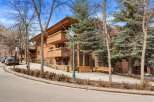 Experience luxury mountain living in this stunning property featuring a striking timber-framed exterior and expansive balconies perfect for enjoying the crisp alpine air.