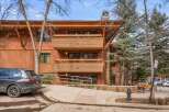 Experience mountain living in this stunning property featuring a warm, wood-clad exterior and multiple balconies perfect for enjoying the crisp alpine air.