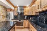 Experience the perfect blend of rustic charm and modern convenience in this stunning kitchen.
