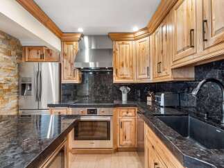 Experience the perfect blend of rustic charm and modern convenience in this stunning kitchen.