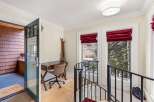 Step into this charming entryway featuring a convenient desk area perfect for managing your affairs.