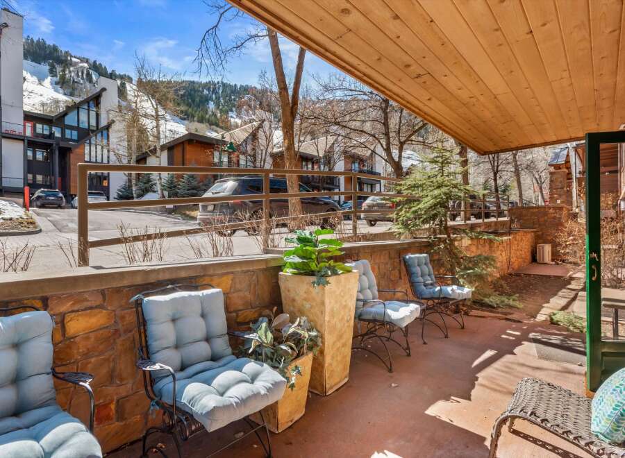 Enjoy the mountain views from this charming patio, perfect for relaxing after a day on the slopes.