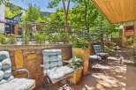 Enjoy the serene mountain views from this charming outdoor seating area, perfect for relaxing or entertaining.