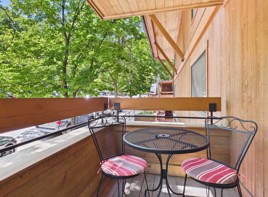 Enjoy your morning coffee or evening drink on this charming balcony, complete with a bistro set perfect for two.