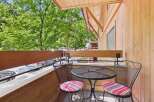 Enjoy your morning coffee or evening drink on this charming balcony, complete with a bistro set perfect for two.