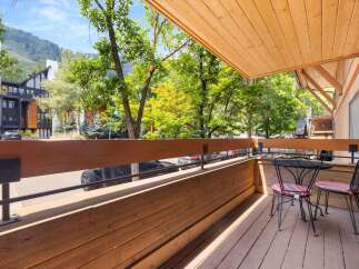 Enjoy your morning coffee or evening drinks on this charming balcony, complete with a bistro set for two.