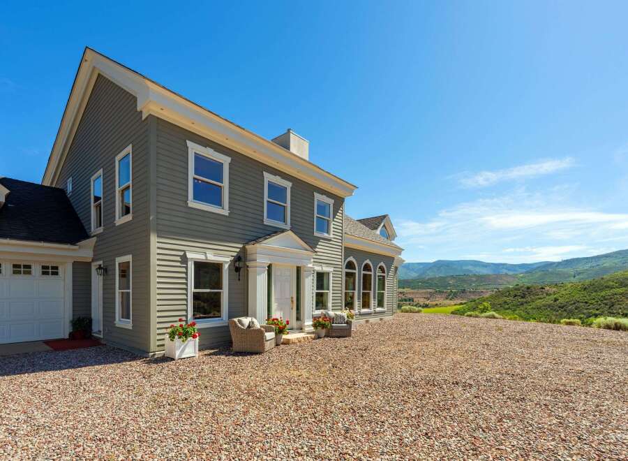 Experience luxury living in this stunning home, nestled amidst breathtaking mountain views.