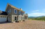 Experience luxury living in this stunning home, nestled amidst breathtaking mountain views.