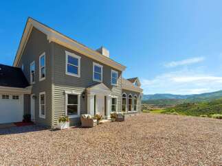 Experience luxury living in this stunning home, nestled amidst breathtaking mountain views.