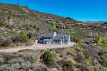 Nestled on a scenic hillside, this stunning property offers breathtaking views and a sense of secluded luxury.