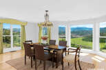 Experience breathtaking mountain views from this elegant dining room, perfect for hosting memorable gatherings.