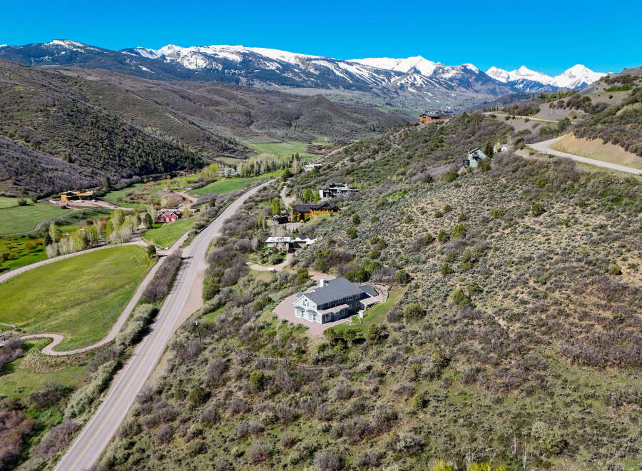 Nestled in a picturesque mountain valley, this stunning property offers breathtaking panoramic views of snow-capped peaks.