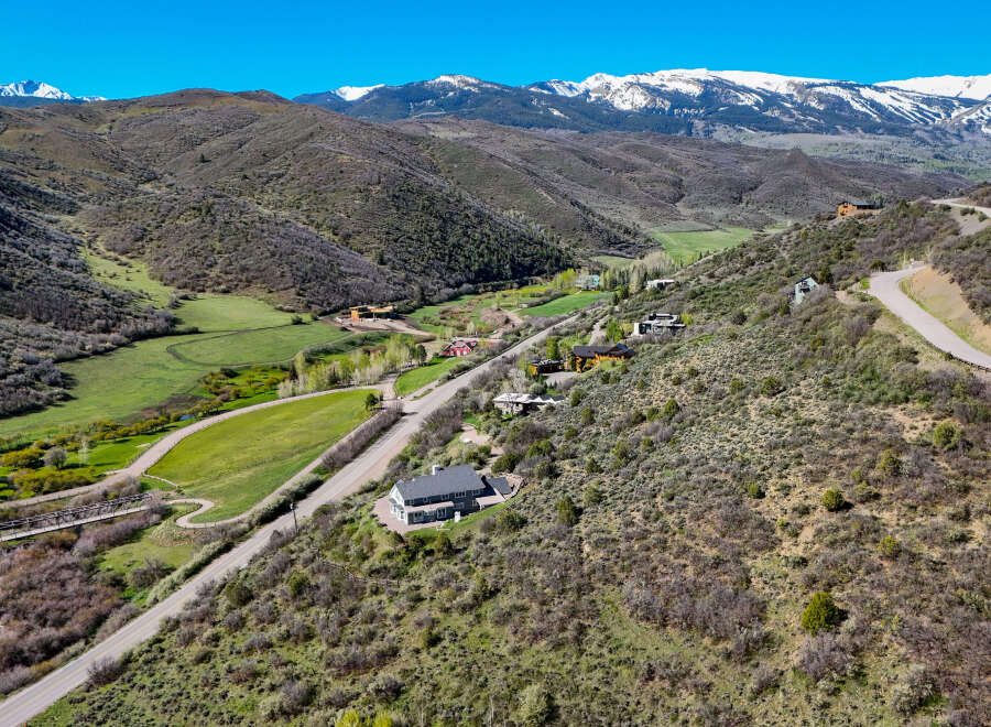 Nestled amidst rolling hills and majestic snow-capped mountains, this property offers a serene escape with breathtaking panoramic views.
