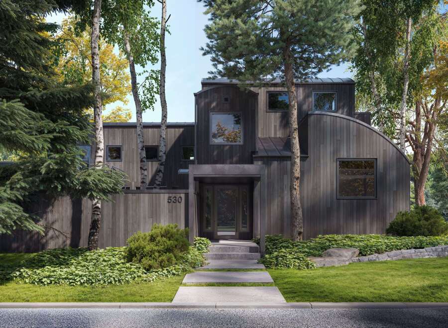 Discover modern architectural brilliance with this stunning home, featuring a unique dark wood exterior and a striking curved roofline.