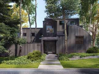 Discover modern architectural brilliance with this stunning home, featuring a unique dark wood exterior and a striking curved roofline.