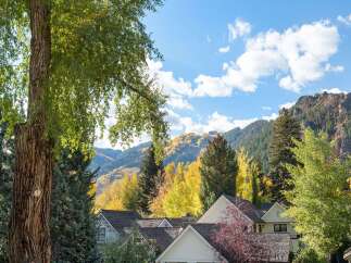 Experience the beauty of autumn in this stunning mountain home, nestled amongst vibrant fall foliage.