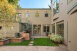 This charming property features a private backyard oasis perfect for entertaining, complete with a built-in grill and ample seating areas.