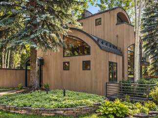 Discover this unique architectural gem nestled amidst lush greenery.