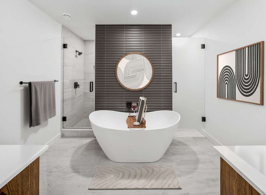 Experience ultimate relaxation in this luxurious bathroom, featuring a stunning freestanding bathtub perfect for unwinding.