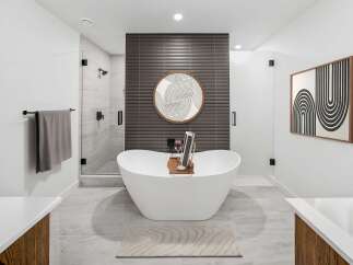 Experience ultimate relaxation in this luxurious bathroom, featuring a stunning freestanding bathtub perfect for unwinding.