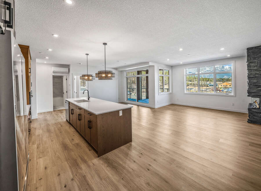 Experience modern living in this stunning open-concept home featuring a spacious kitchen island perfect for entertaining.