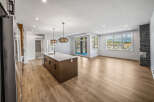 Experience modern living in this stunning open-concept home featuring a spacious kitchen island perfect for entertaining.