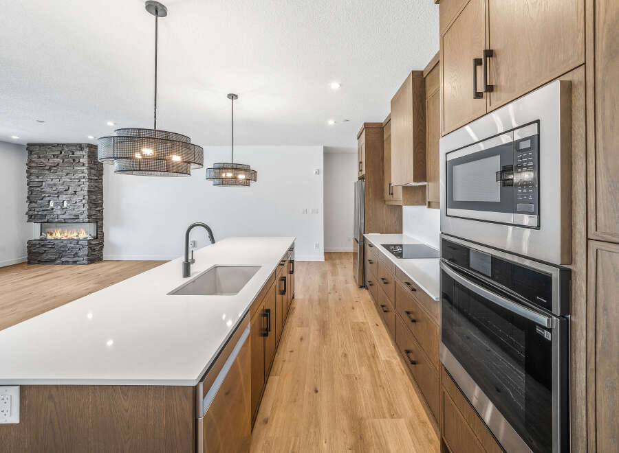 Experience modern luxury in this stunning open-concept kitchen and living area.